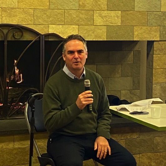 Club members engaged Town Manager Adam Wolff at an informal fireside chat in January.